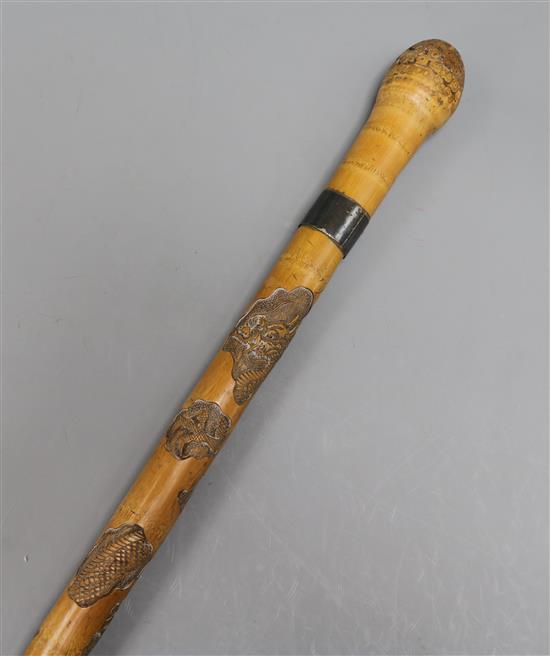 A Japanese carved bamboo walking stick